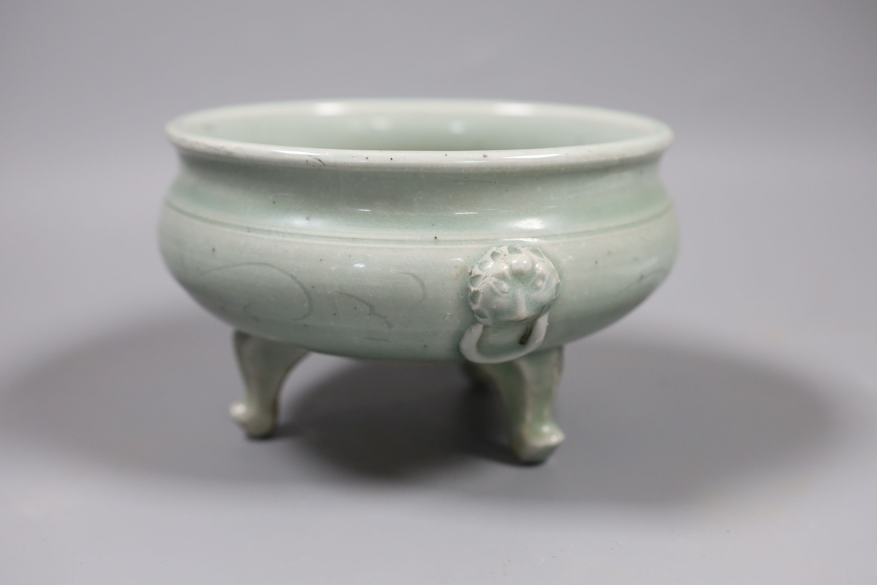 A Chinese celadon tripod censer, Ming or later, 16.5 cm diameter